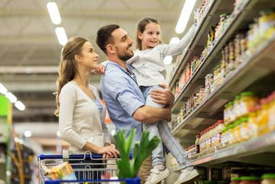Man woman and child in grocery store aisle - Grocery store pest control services with City Termite & Pest Control in Malvern, AR